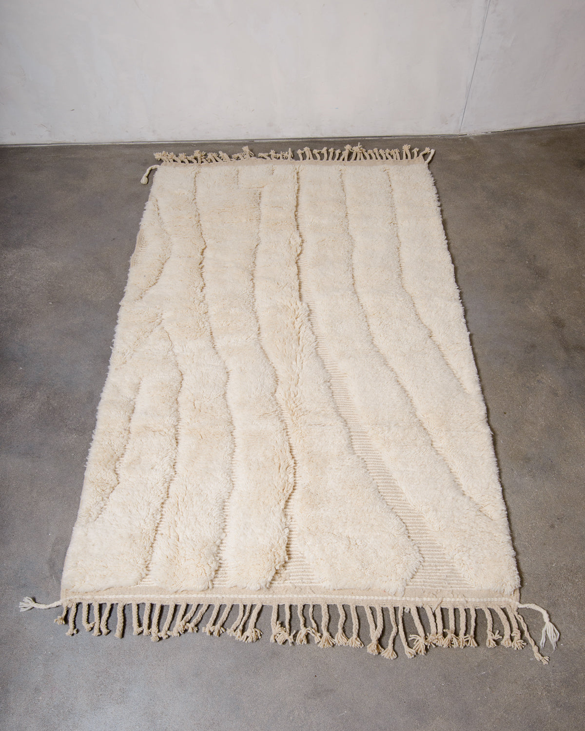 Modern, designer, handcrafted Berber rug from Morocco. Beniourain carpet with minimalist design, natural wool pile and a fluffy texture.